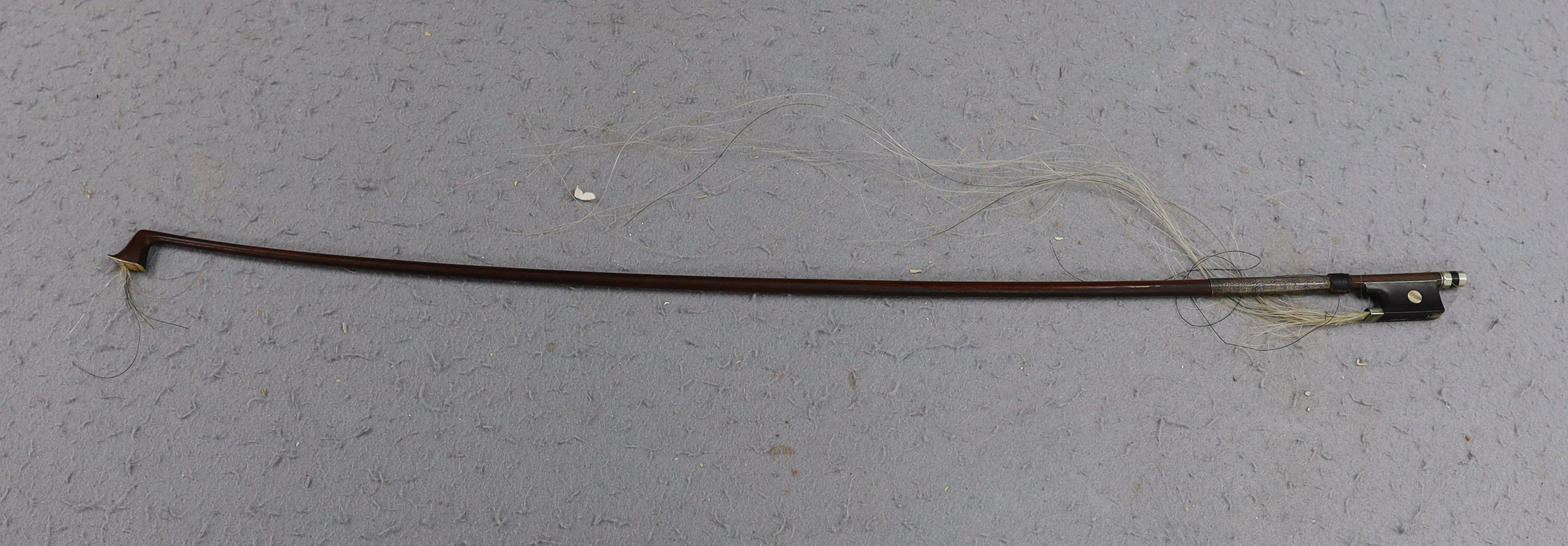 A cased 19th century violin, labelled Stradivarius 1690, with a Dodd bow